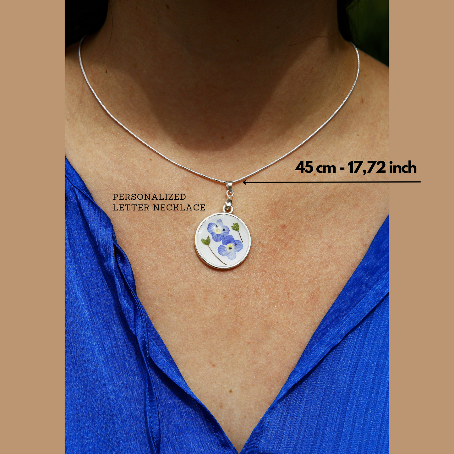 S Styles Bijoux, Handmade silver necklace featuring real pressed blue flowers preserved in resin. A unique and elegant gift, perfect for special occasions.